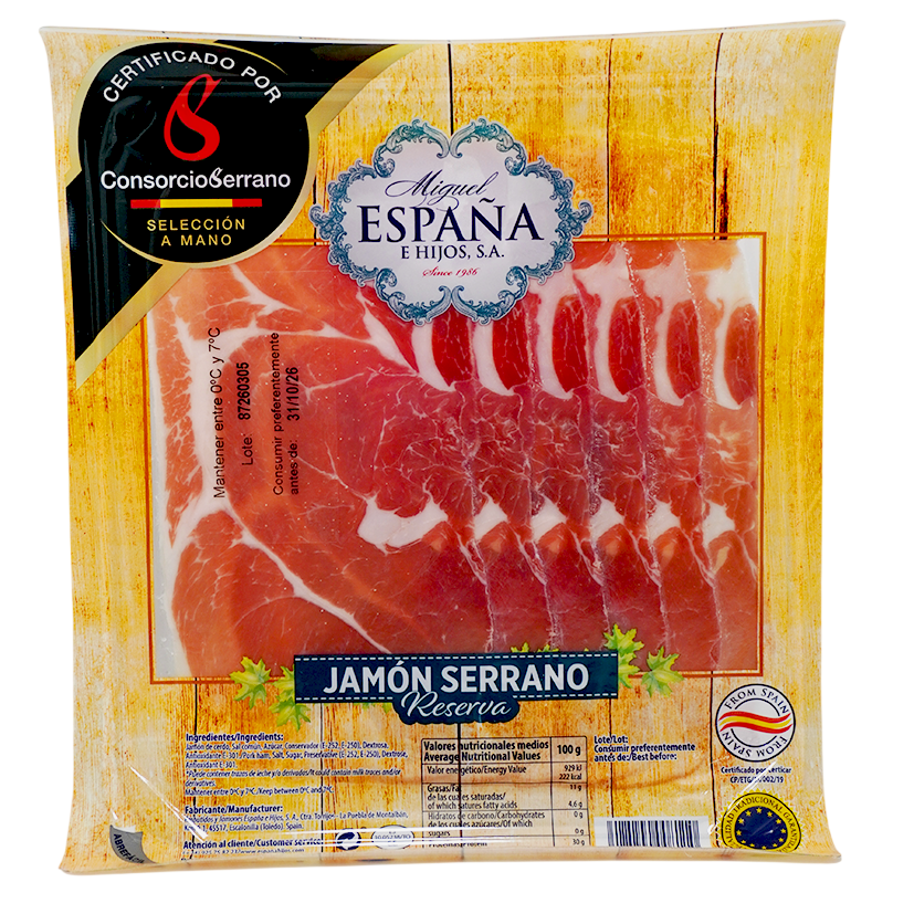 Packaged sliced ham in a clear plastic bag with a printed front panel. The package shows the brand names 'Miguel España' and 'Consorcio Serrano', along with a large photo of pink cured meat slices on a yellow wood-grain style background.
